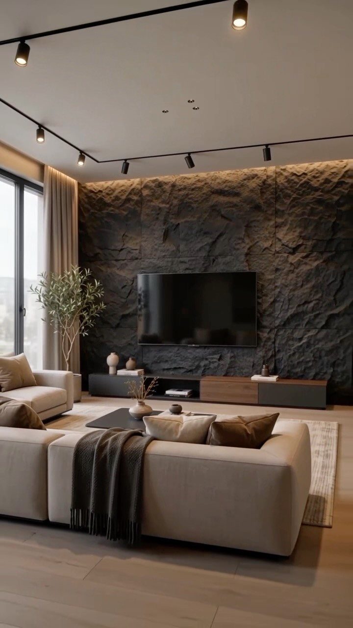 Dark grey textured stone accent wall in a modern living room with beige sofa.