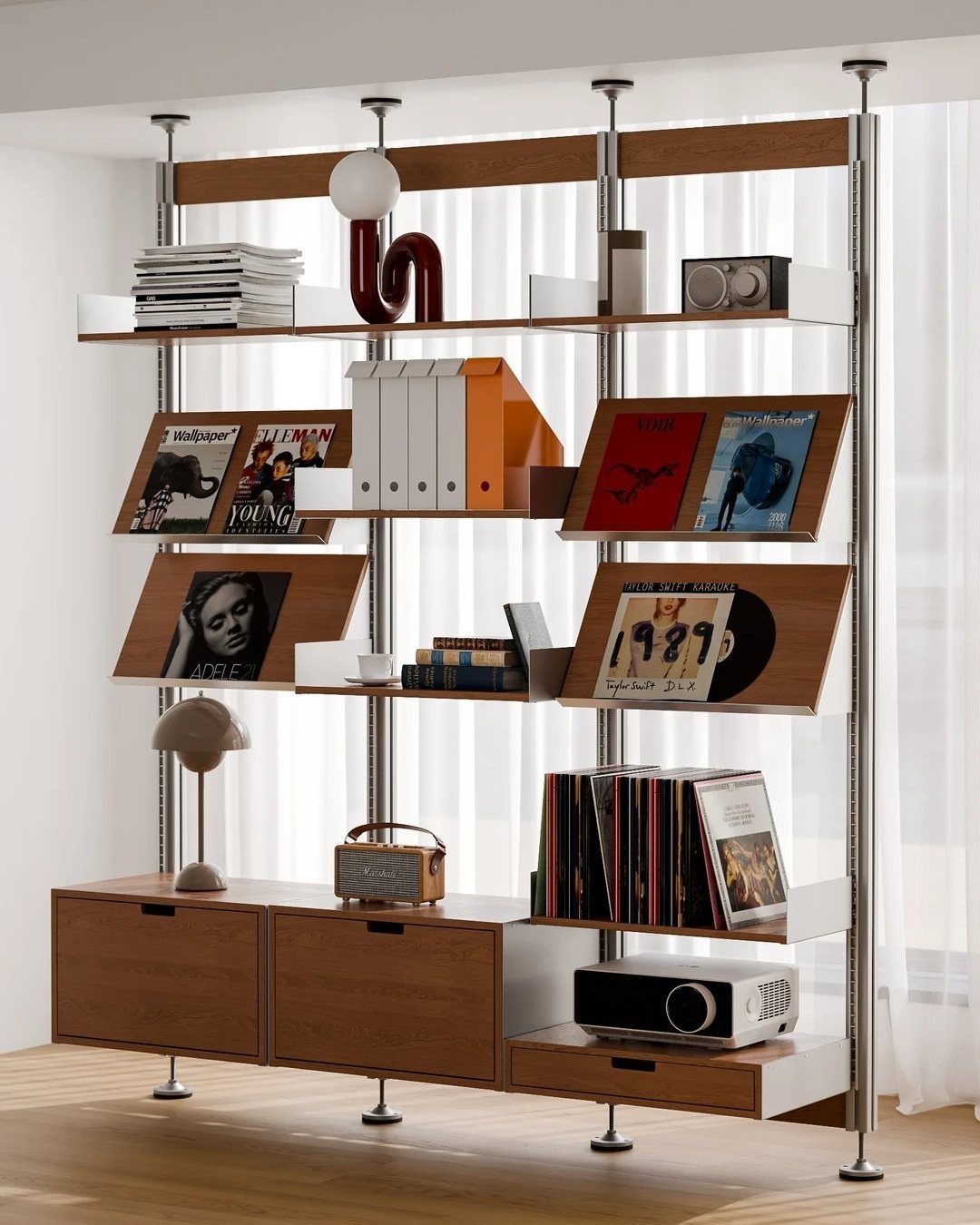 Modular shelving system with wooden shelves and metal supports holding books and electronics.