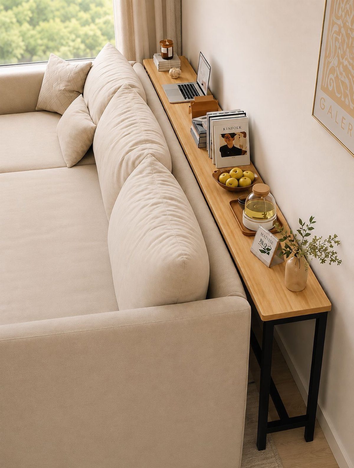 Beige fabric sofa placed next to a wooden console table with decorative items.