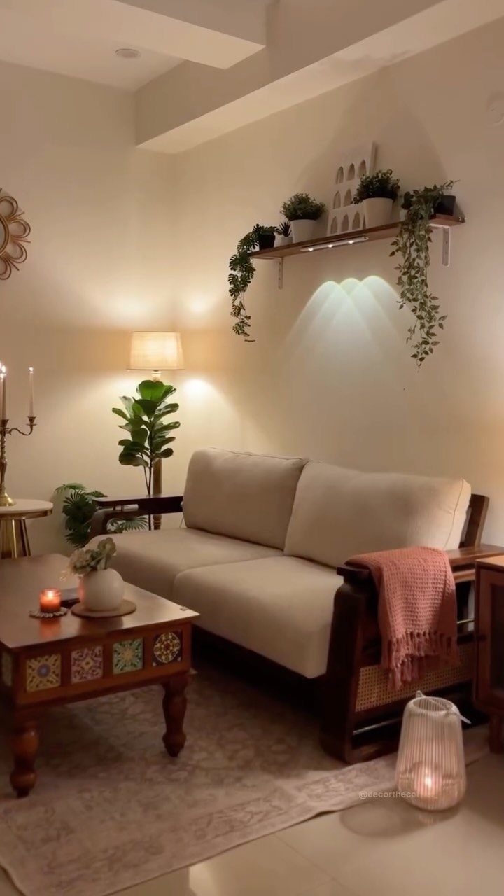Beige sofa and carved wooden coffee table in a cozy small living room