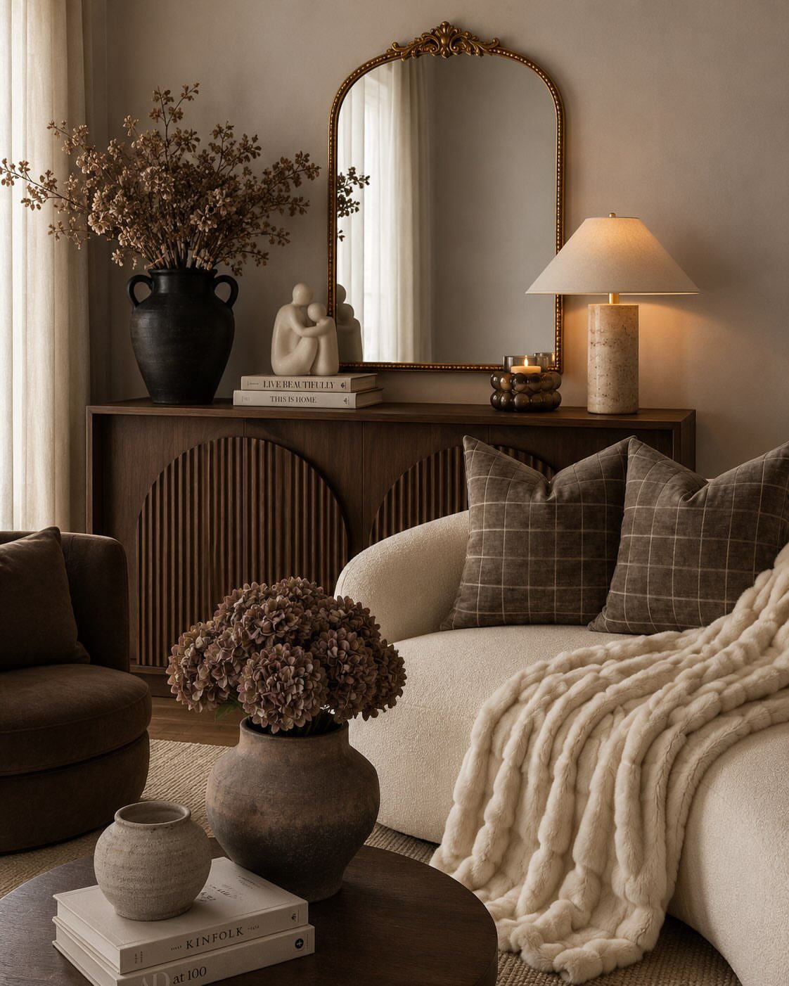 Cream sofa and dark brown wooden sideboard in a neutral toned living room