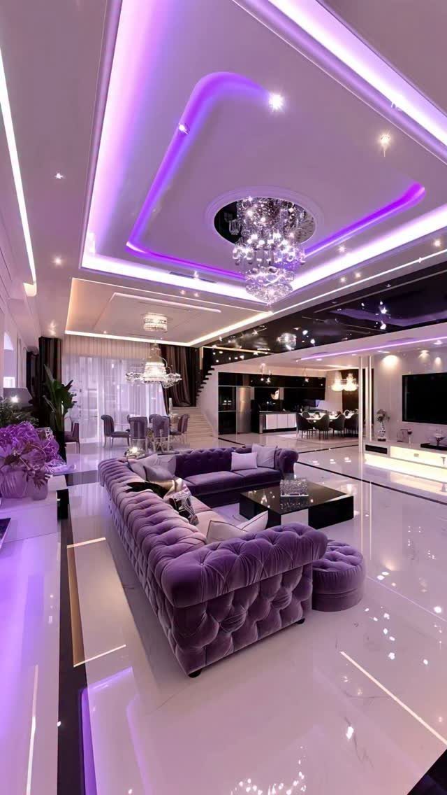 Purple tufted velvet sectional sofa in a modern living room with purple lighting.