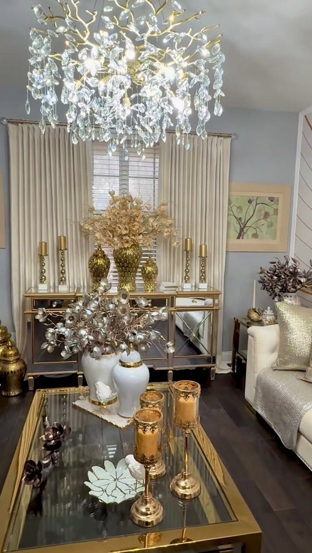 Gold metallic decor items including a coffee table and vases in a luxury living room