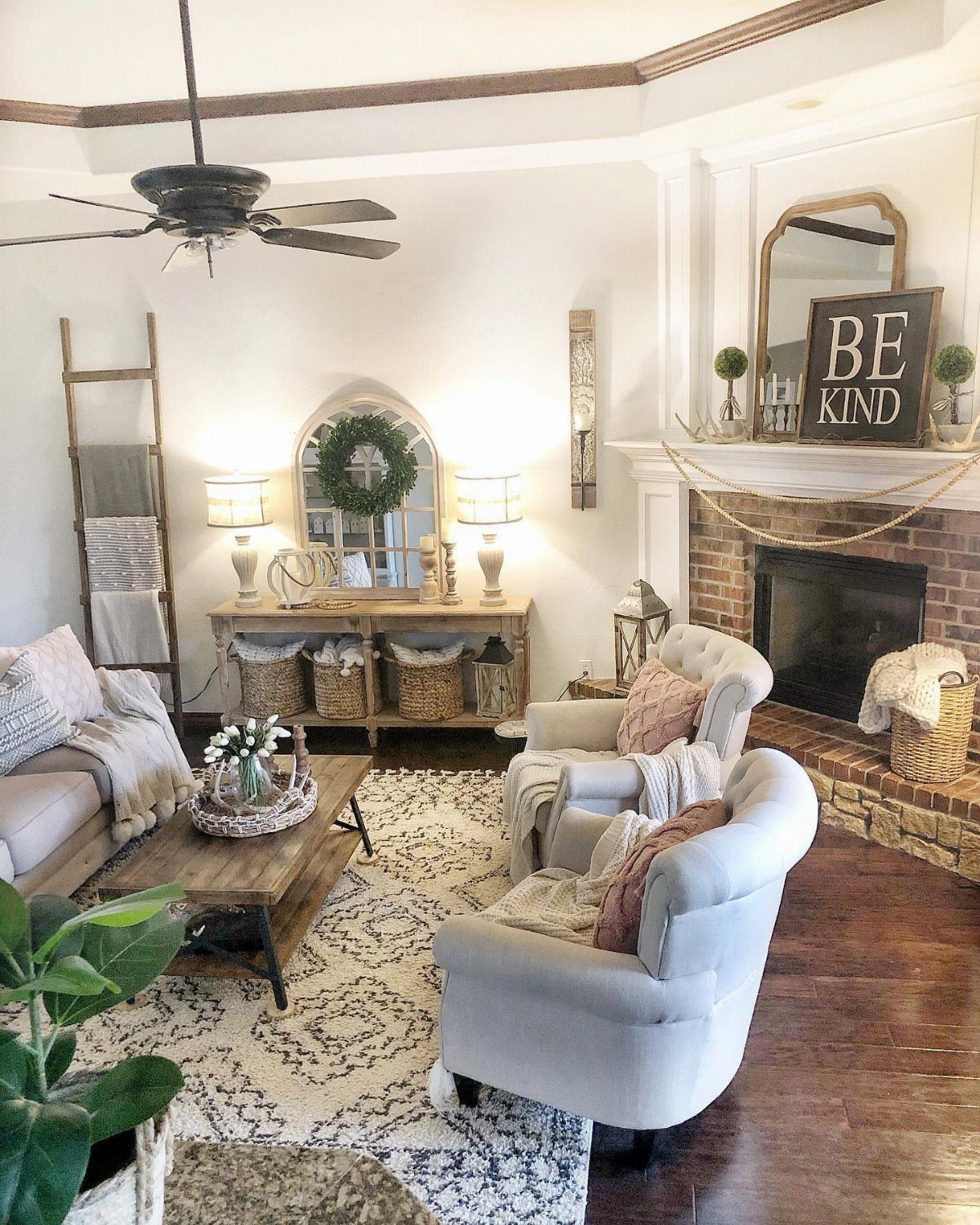 Living room with a brick fireplace positioned off-center relative to the room's layout.