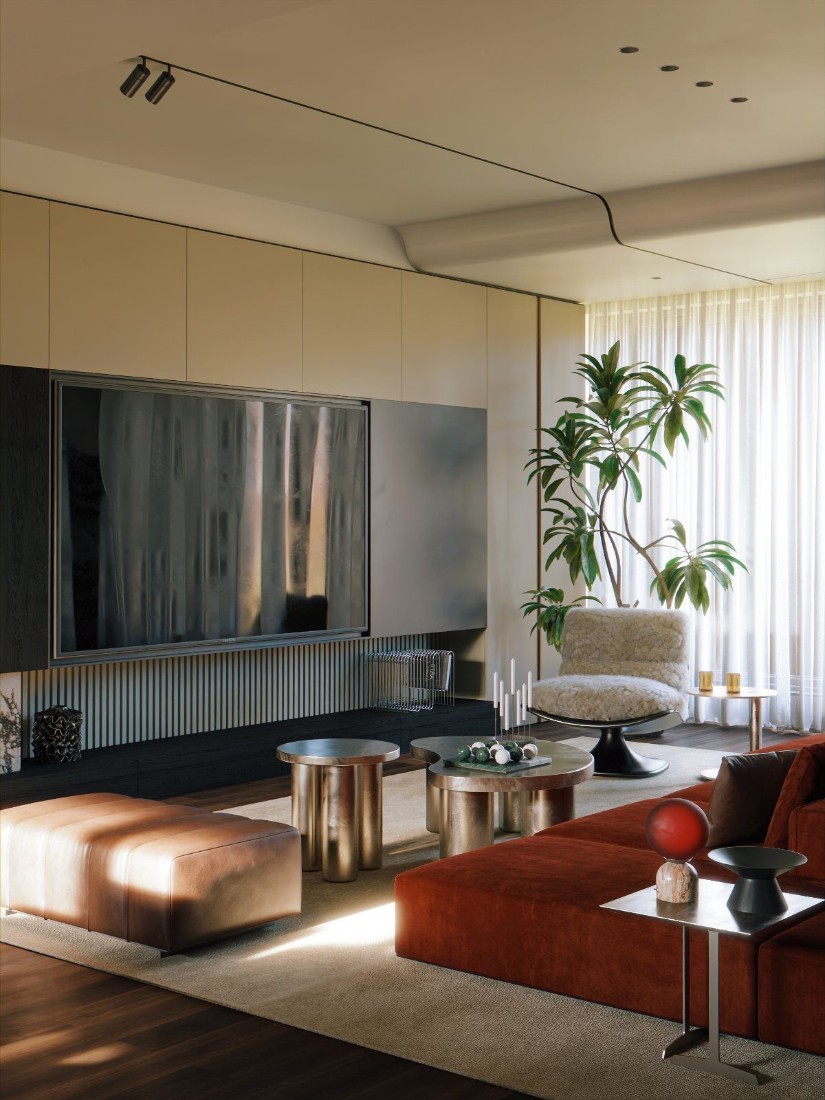 Modern living room with rust-colored sofa, metallic tables, and minimalist track ceiling lighting.