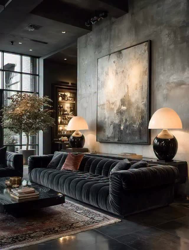 Two large black spherical table lamps with white shades in a modern living room.
