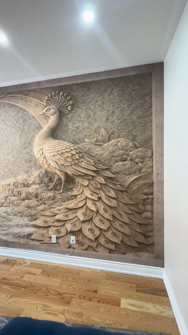 Large neutral-toned peacock wall mural above light hardwood floors in a room.