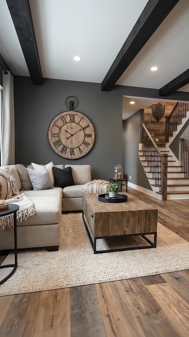 Living room with black ceiling beams, beige sofa, and large wooden wall clock.