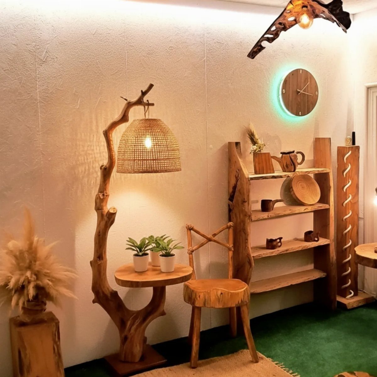 Natural wood furniture with organic shapes including a chair, table, and shelving unit.