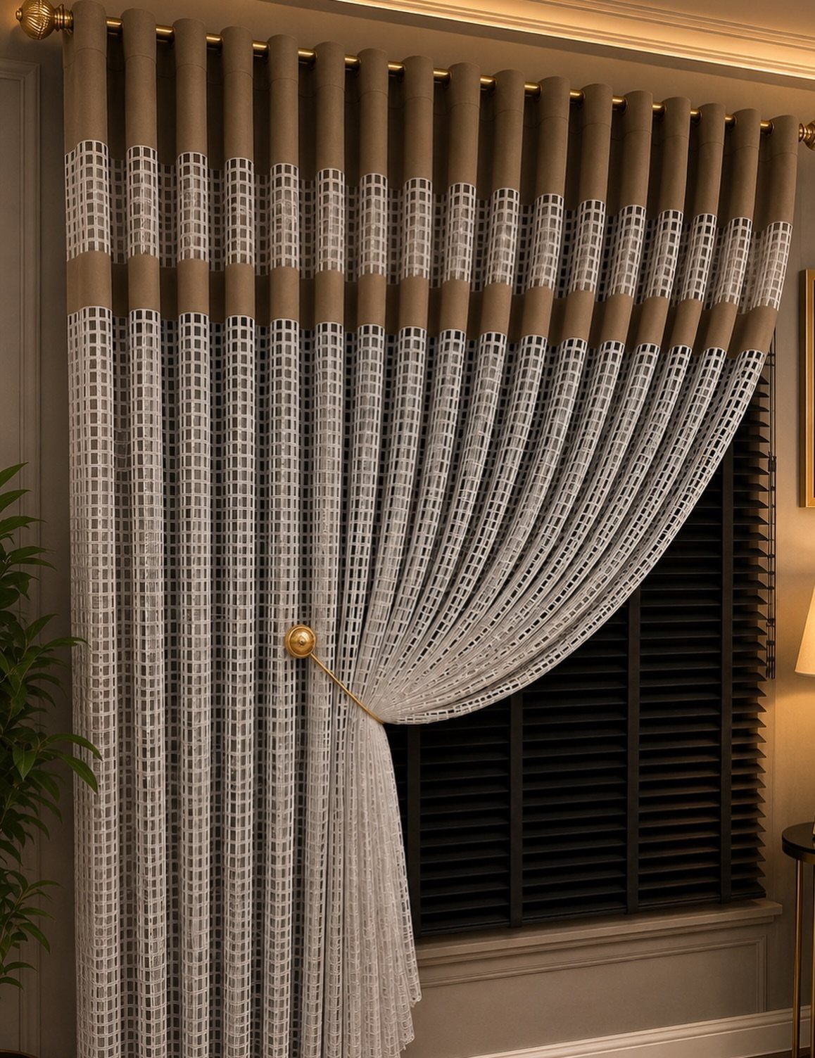 Patterned white and grey curtains with brown headers hanging over black window blinds.