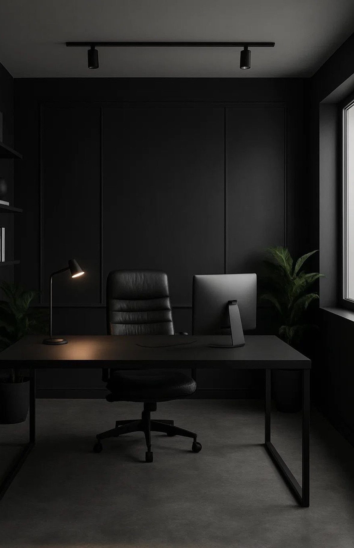 Black desk and leather chair in a dark office with paneled walls