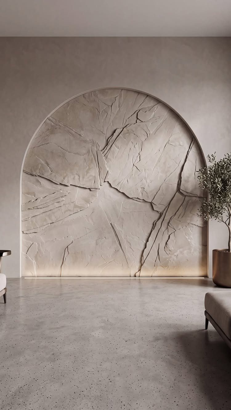 Arched wall niche with rough carved stone texture in a neutral modern room