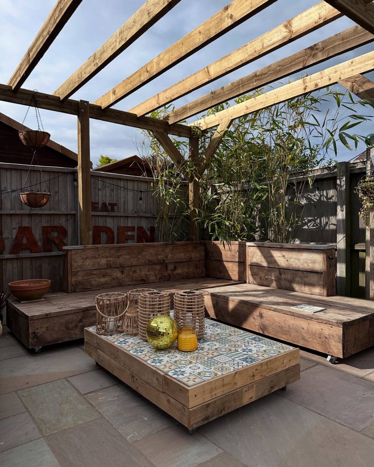 Pallet wood coffee table with tiled top in an outdoor patio setting