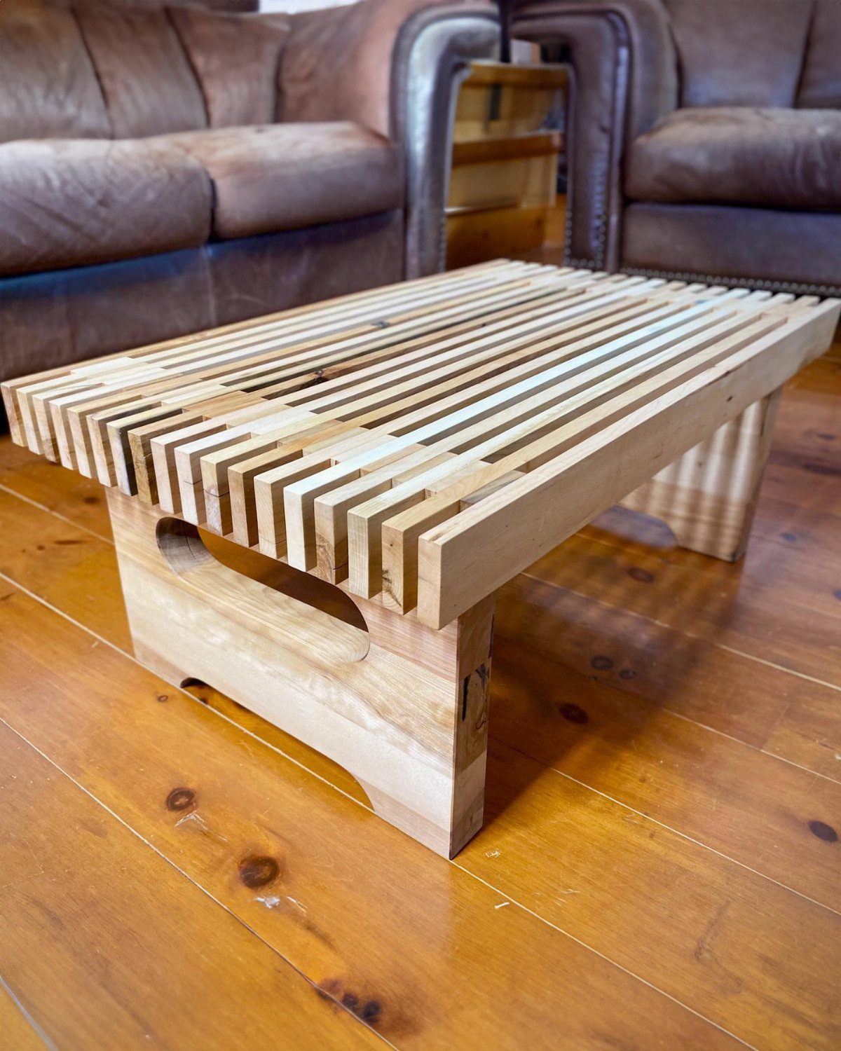Pallet wood coffee table with slatted top on a polished wooden floor