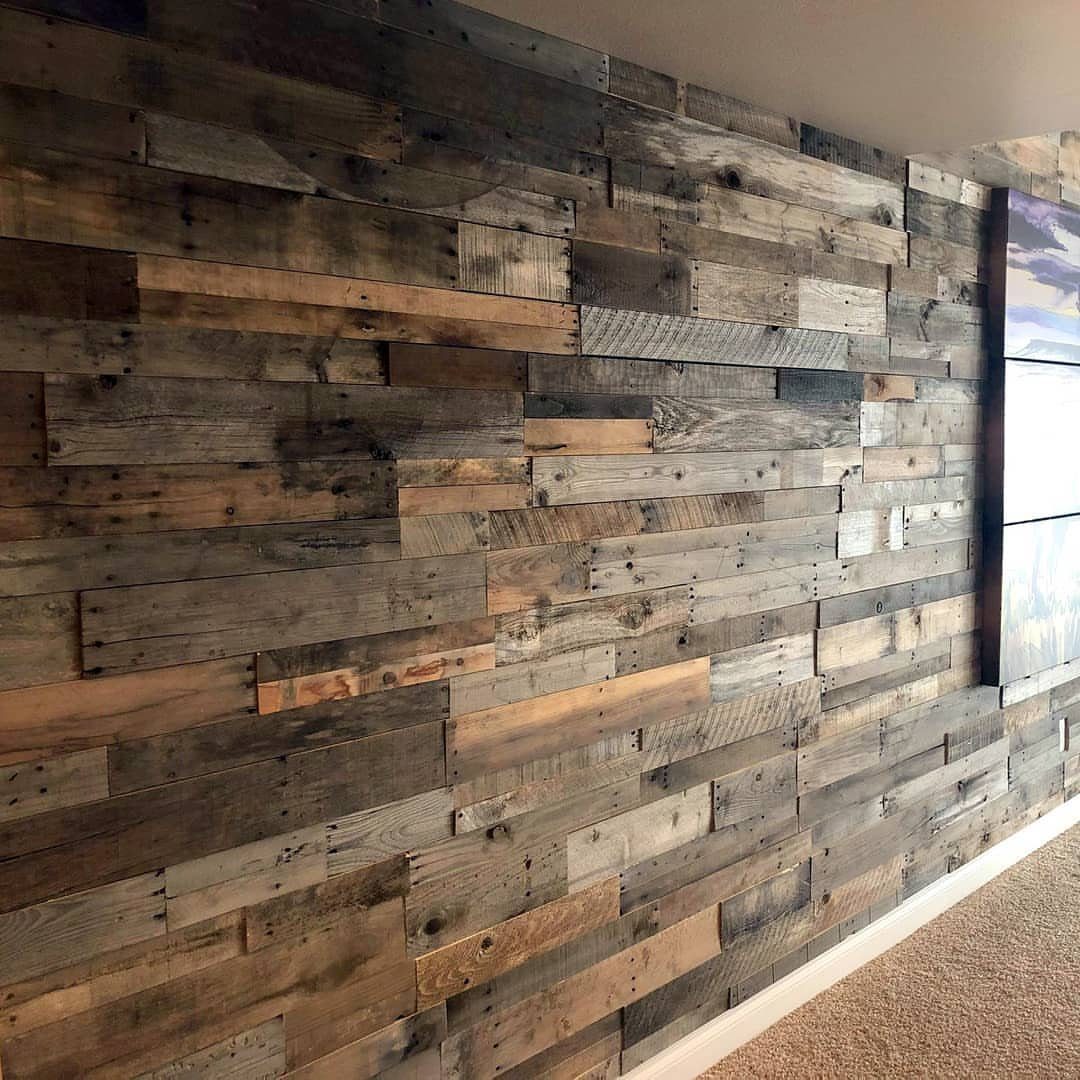 Reclaimed wood accent wall with weathered grey and brown horizontal planks.