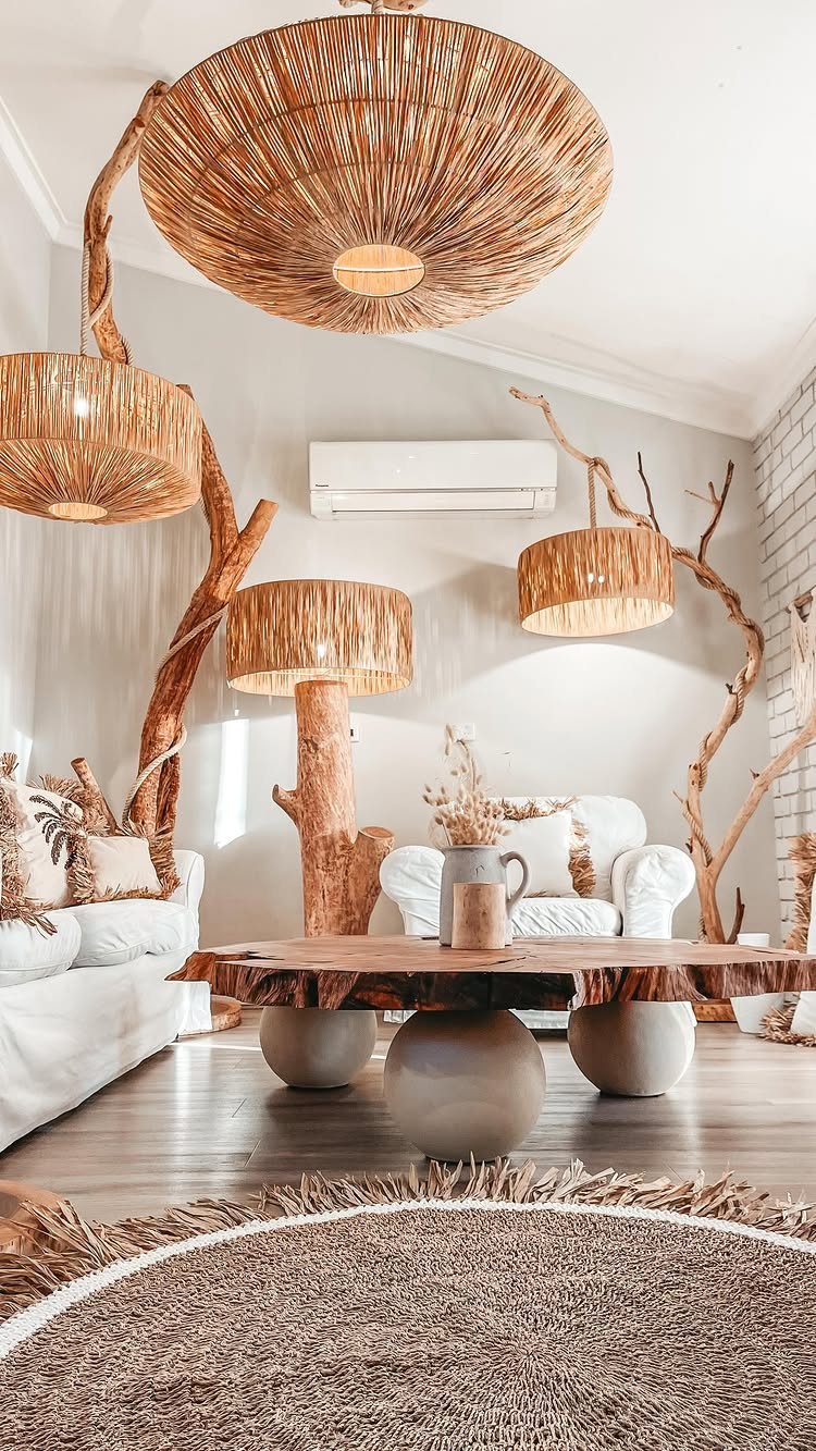 Rustic contemporary living room with live-edge wood table and woven wicker lighting fixtures.