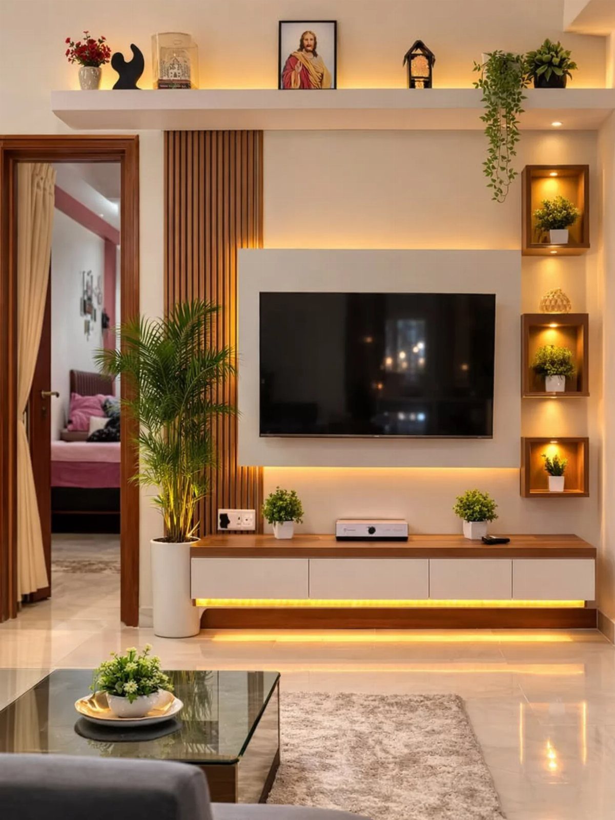 Wall-mounted TV with backlit panel and wooden accents as a living room focal point