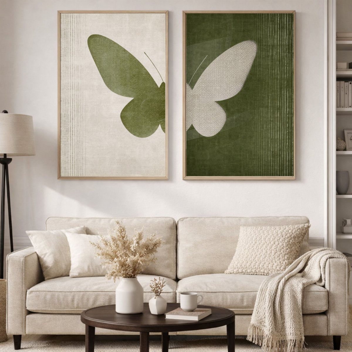 Two large framed butterfly prints hanging above a beige sofa in a living room.