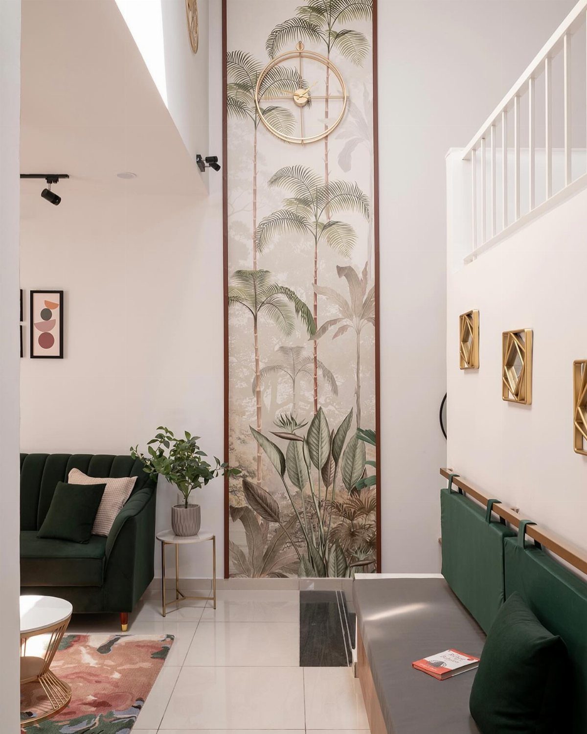 Narrow living room with a tall tropical palm tree wall mural and green sofa.
