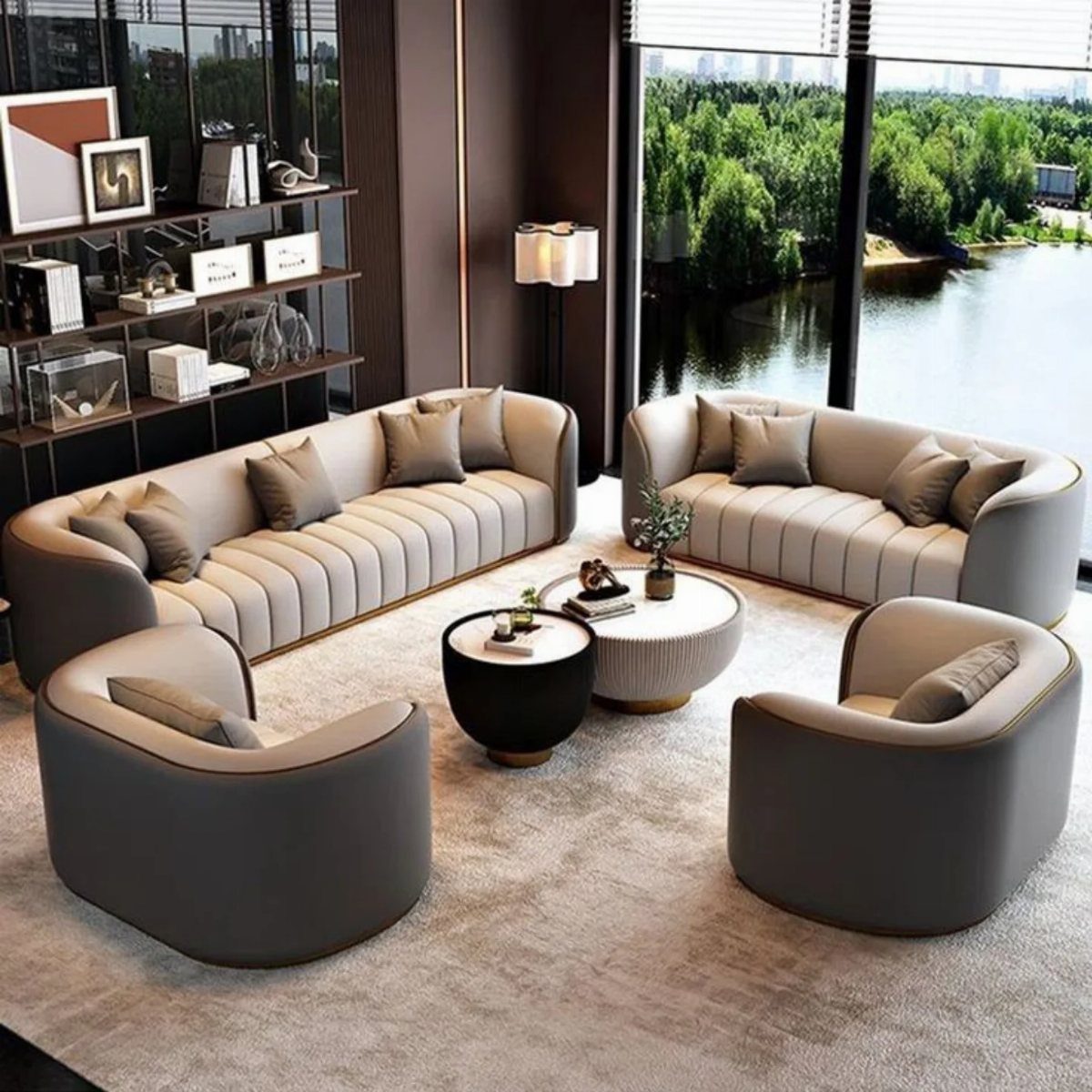 Two curved beige sofas and two grey armchairs in a modern living room