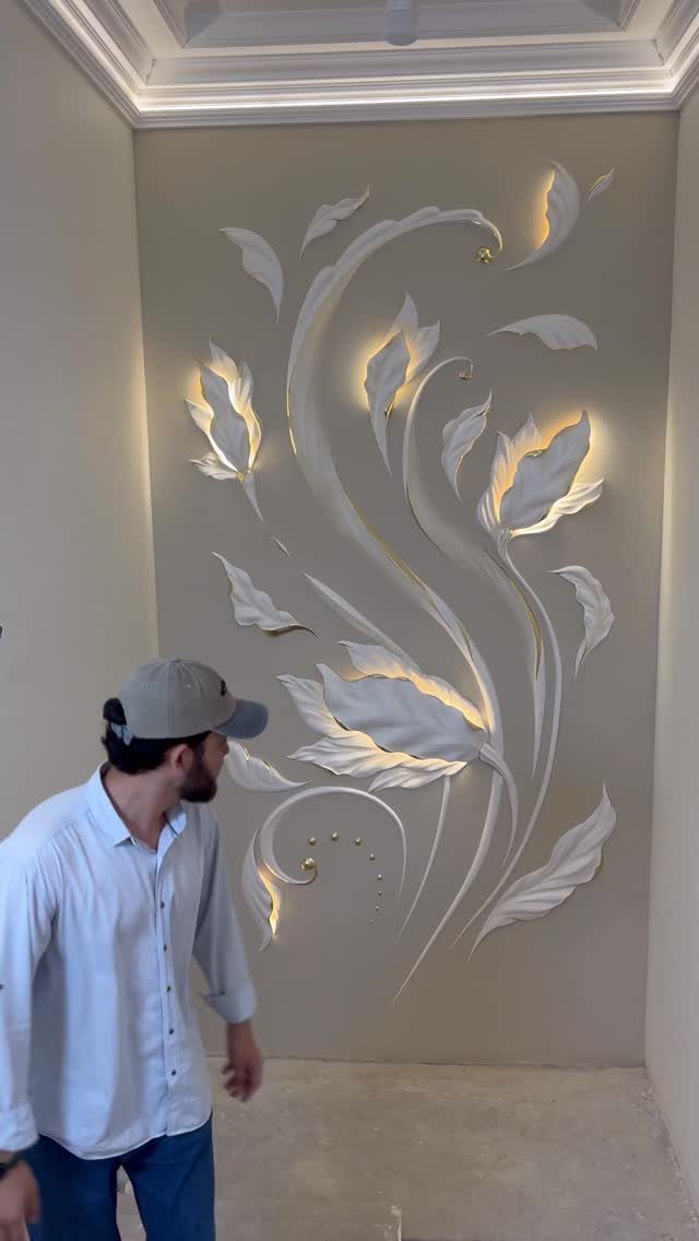 3D floral wall sculpture with warm integrated lighting in a beige room